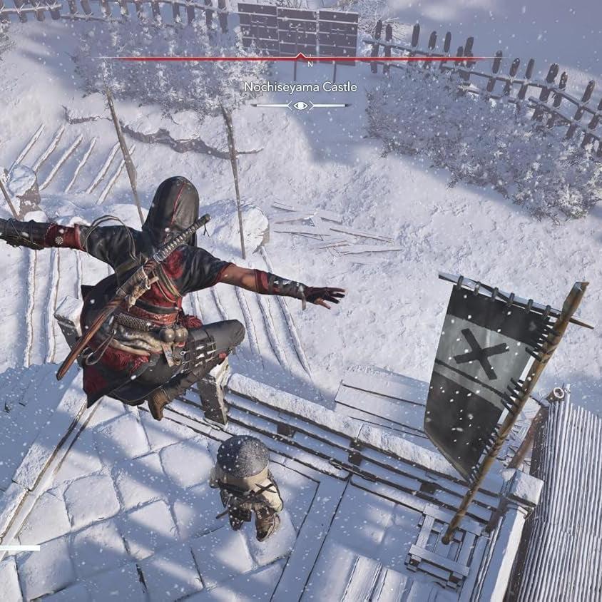 Assassin's Creed Shadows character in black and red ninja attire leaping over a snowy feudal Japanese rooftop.